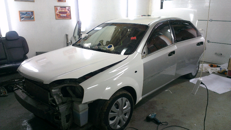 Фотография работы: Chevrolet Cruze, Lacetti, Aveo и Daewoo Nexia - оклейка автомобилей для такси в белый цвет - сентябрь 2013