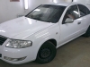 Фотография работы: Оклейка автомобиля Nissan Almera белой пленкой для такси - май 2013