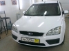 Фотография работы: Оклейка автомобиля Ford Focus белой пленкой для такси - май 2013
