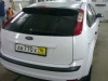 Фотография работы: Оклейка автомобиля Ford Focus белой пленкой для такси - май 2013